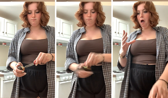 Young woman in kitchen slicing avocado, showing common mistake linked to doctor's avocado hands warning going viral. Young woman in kitchen slicing avocado, showing common mistake linked to doctor's avocado hands warning going viral.