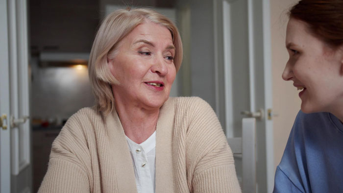 Elderly lady talking to younger woman indoors, involved in a story about allegedly planning to steal neighbor’s doggo. Elderly lady talking to younger woman indoors, involved in a story about allegedly planning to steal neighbor’s doggo.