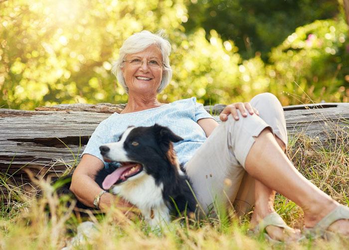 Elderly lady sitting outdoors with dog, owner in shock over alleged plan to steal neighbor’s doggo.
