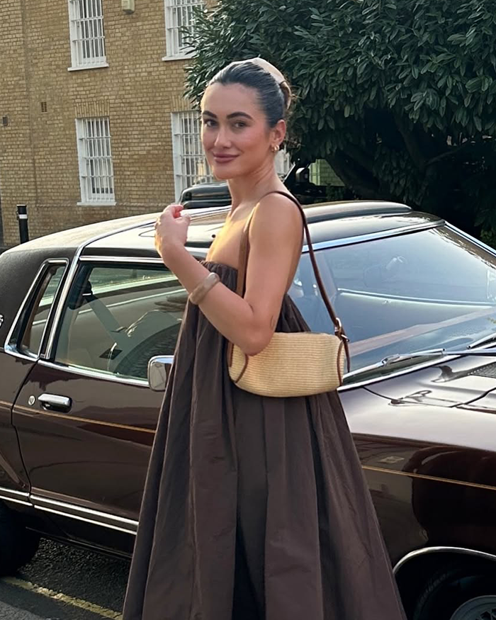 Woman posing by vintage car, sharing story of psychic drawing that allegedly changed her love life quickly. Woman posing by vintage car, sharing story of psychic drawing that allegedly changed her love life quickly.