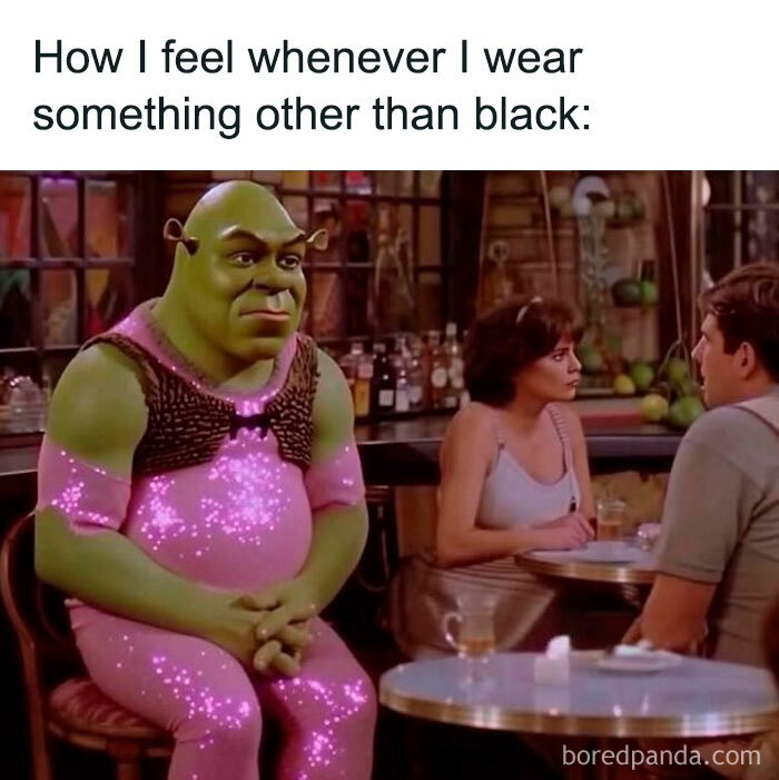 Shrek in a pink sparkly outfit looking uncomfortable at a restaurant, representing meme humor about wearing colors other than black.