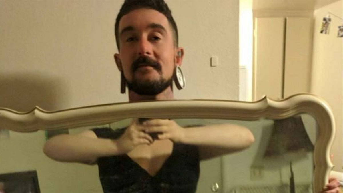 Man holding a mirror reflecting a person's body, illustrating hilarious times people tried to sell a mirror with its reflection.
