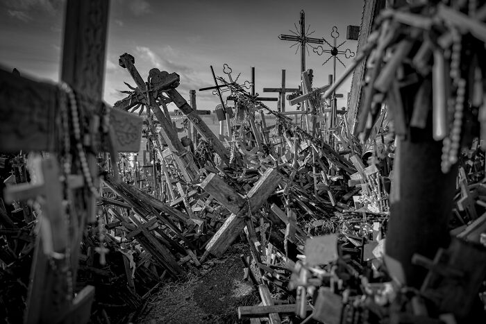 Spooky destination with numerous wooden crosses and rosaries under a cloudy sky, perfect for Halloween visits. Spooky destination with numerous wooden crosses and rosaries under a cloudy sky, perfect for Halloween visits.