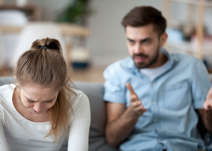 Woman upset after husband disputes her, reflecting tension over tummy tuck savings in a home setting. Woman upset after husband disputes her, reflecting tension over tummy tuck savings in a home setting.