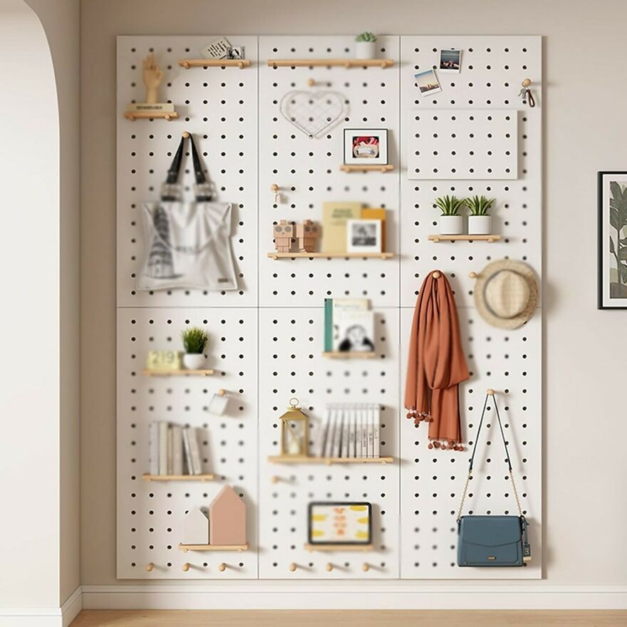 Home organization hacks using pegboard shelves, hooks, and baskets to maximize storage and declutter living space.