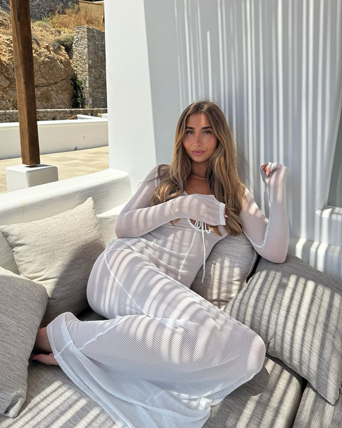 Lily Phillips lounging on a couch indoors wearing a white dress, capturing attention with her relaxed pose and natural look. Lily Phillips lounging on a couch indoors wearing a white dress, capturing attention with her relaxed pose and natural look.