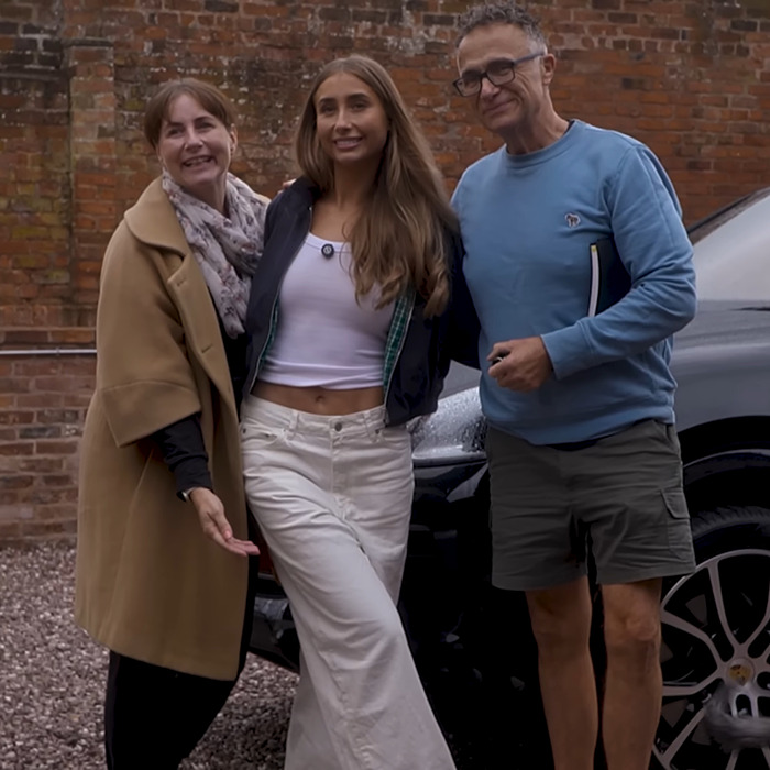 Lily Phillips posing outdoors with two people, sharing insights about her fame and experiences for the love of money. Lily Phillips posing outdoors with two people, sharing insights about her fame and experiences for the love of money.