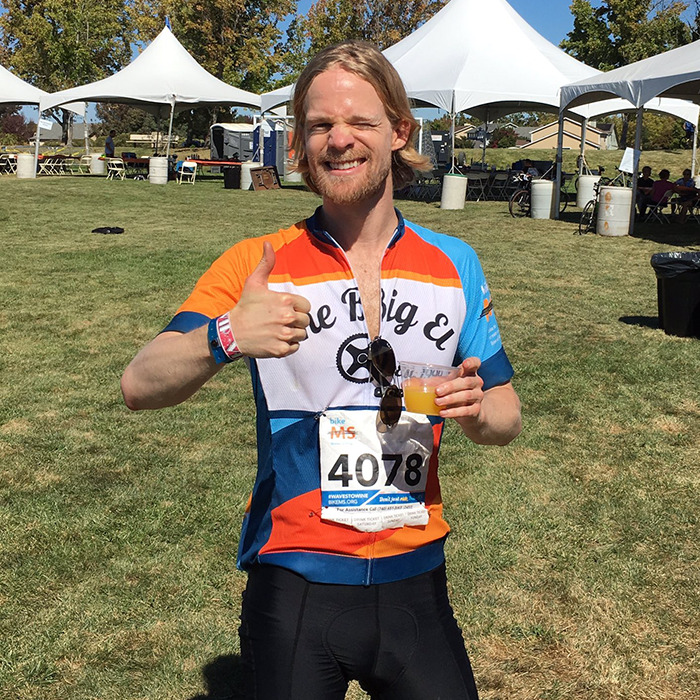 Man behind blinking guy GIF giving thumbs up at outdoor cycling event wearing race number 4078 and colorful jersey. Man behind blinking guy GIF giving thumbs up at outdoor cycling event wearing race number 4078 and colorful jersey.