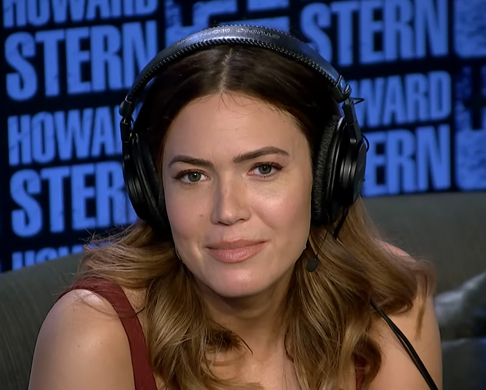 Mandy Moore in a radio studio wearing headphones, showcasing her new unrecognizable look that baffles fans. Mandy Moore in a radio studio wearing headphones, showcasing her new unrecognizable look that baffles fans.
