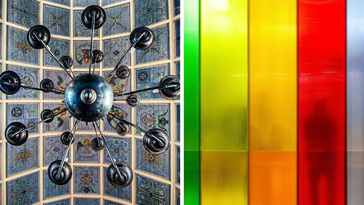 Minimalist architectural design featuring a geometric chandelier and colorful translucent panels with shadowed figures.