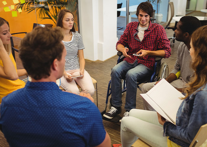 Group therapy session with diverse young adults discussing emotions, reflecting on mom admits she likes one daughter more struggles. Group therapy session with diverse young adults discussing emotions, reflecting on mom admits she likes one daughter more struggles.