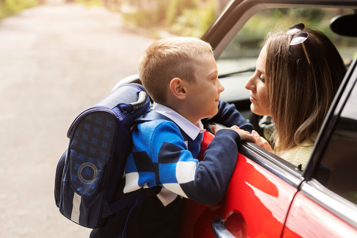 Child with backpack talking to woman in car near daycare, capturing the greedy daycare manager and parking lot chaos. Child with backpack talking to woman in car near daycare, capturing the greedy daycare manager and parking lot chaos.