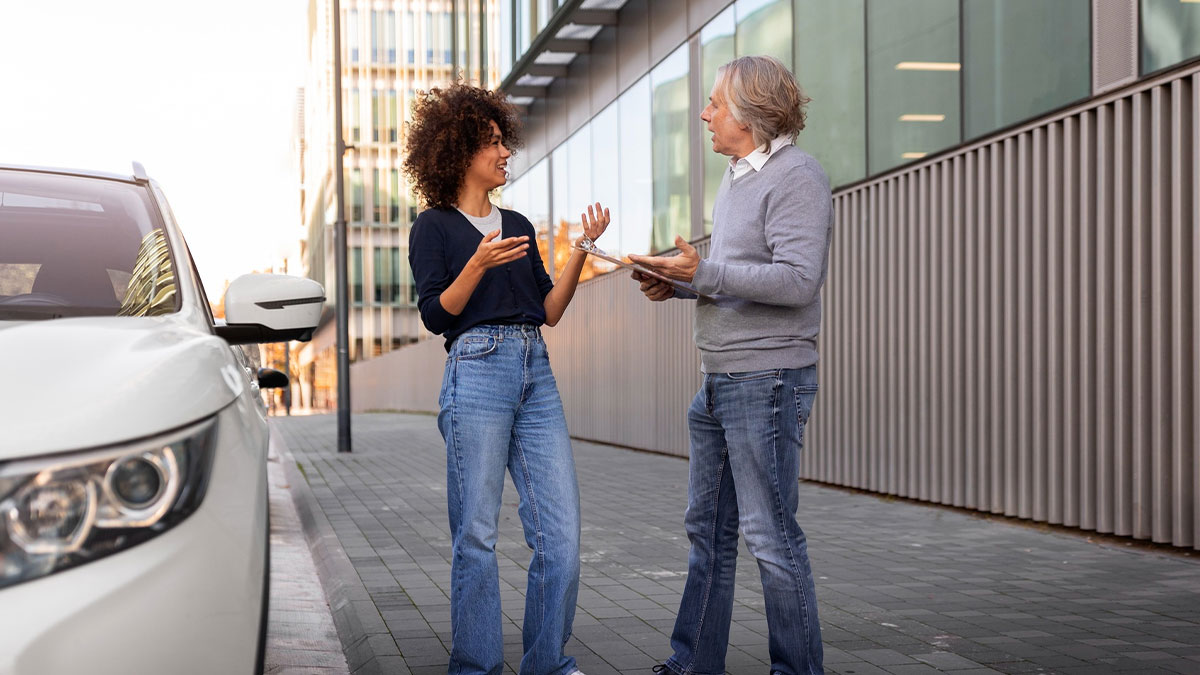 Woman and man arguing next to a white car outside a building, illustrating a daycare manager parking lot conflict.