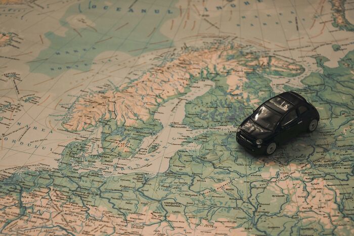 Toy car placed on a detailed map of Europe, highlighting countries and borders, perfect for mastering Europe's map skills. Toy car placed on a detailed map of Europe, highlighting countries and borders, perfect for mastering Europe's map skills.