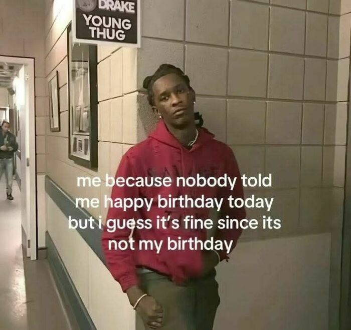 Man in red hoodie leaning against a wall with an unbothered expression, featured in an evil thoughts meme.