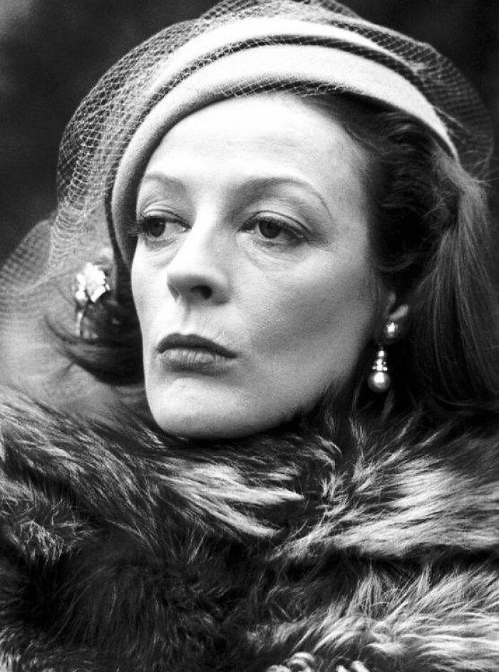 Black and white portrait of a woman wearing a hat and fur coat, representing people who left a mark in movie and music industries. Black and white portrait of a woman wearing a hat and fur coat, representing people who left a mark in movie and music industries.