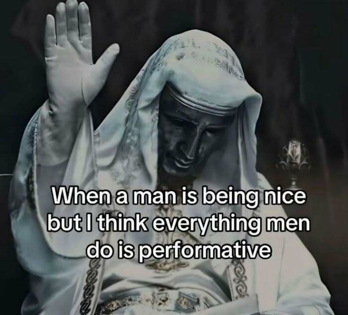 Statue with raised hand and meme text about doubting men's sincerity, illustrating evil thoughts in a humorous way.