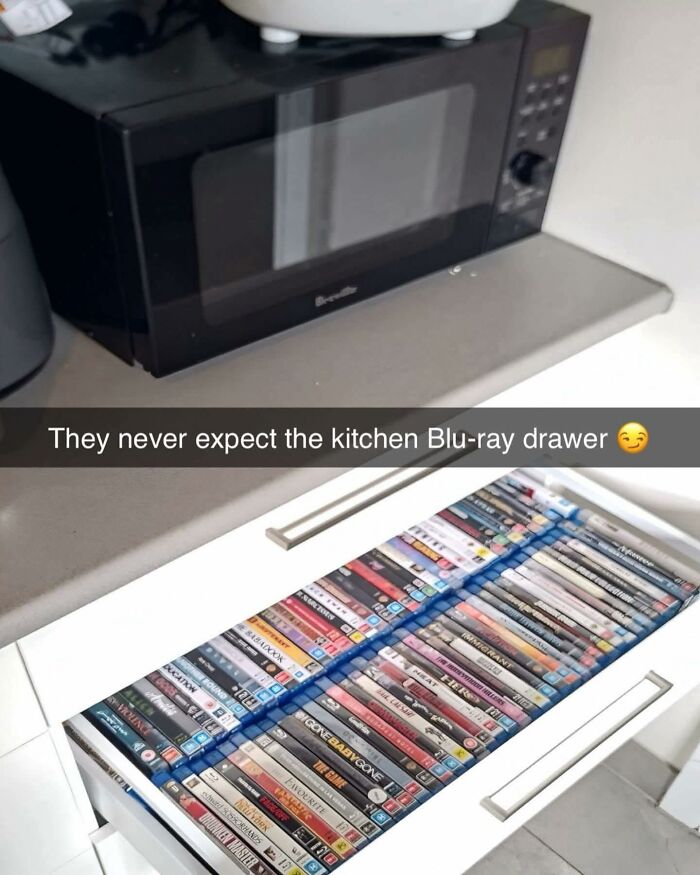 Drawer in a kitchen filled with Blu-ray discs, humorously highlighting out of context pleasures of the occult collection.