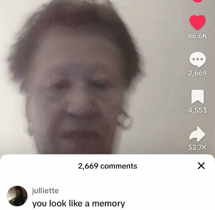 Blurry close-up of an elderly person with earrings on a social media post with many likes and comments about the occult.