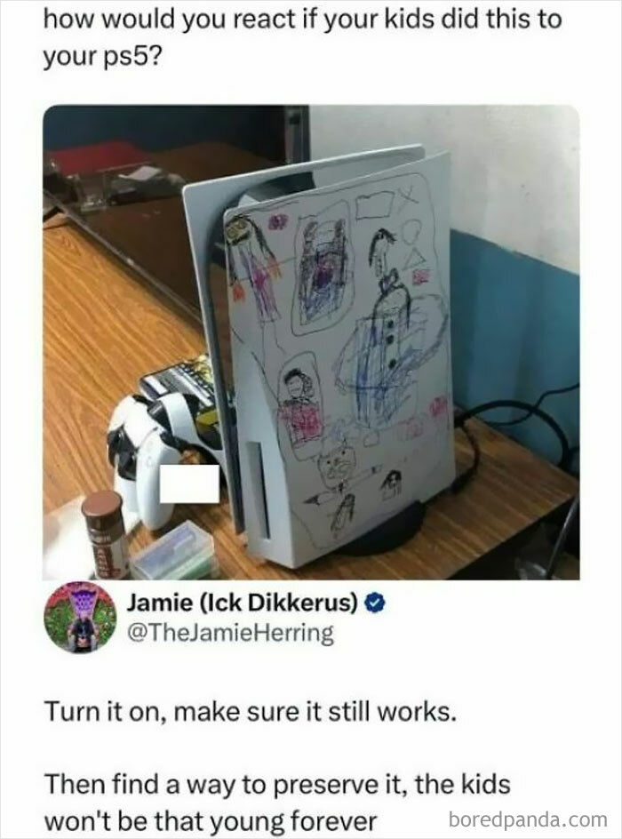 PS5 console covered in children’s colorful drawings on a wooden table, capturing a daily serotonin boost moment.