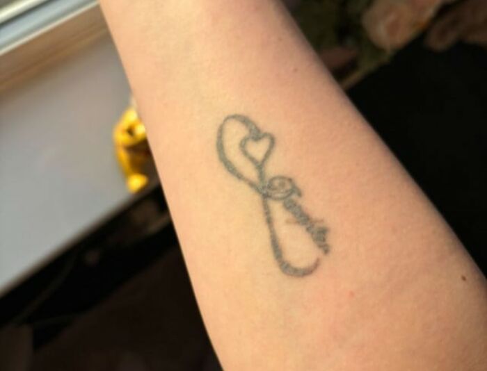 Close-up of a faded infinity tattoo on forearm, illustrating a moment when tattoo artists drew the line with certain requests.