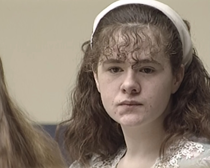 Young woman in a courtroom setting facing a capital punishment date for stabbing a classmate and carving a pentagram Young woman in a courtroom setting facing a capital punishment date for stabbing a classmate and carving a pentagram
