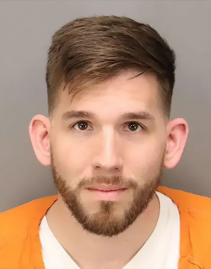 Young man in an orange prison jumpsuit with a beard, arrested after a tantrum at Starbucks over a Pride flag in Florida