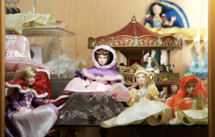 Collection of 50 dolls in a chaotic display inside a fairytale-themed Airbnb with witch-like vintage decor. Collection of 50 dolls in a chaotic display inside a fairytale-themed Airbnb with witch-like vintage decor.