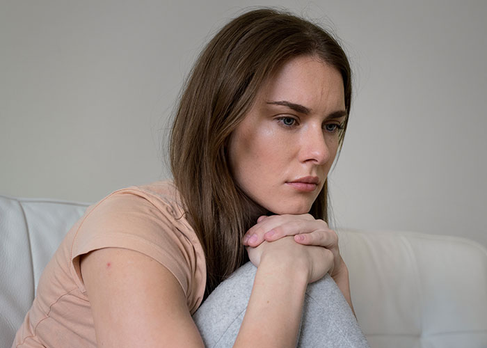Bride looking upset and thoughtful after wedding vendors failed to provide cupcakes due to her allergy concerns. Bride looking upset and thoughtful after wedding vendors failed to provide cupcakes due to her allergy concerns.