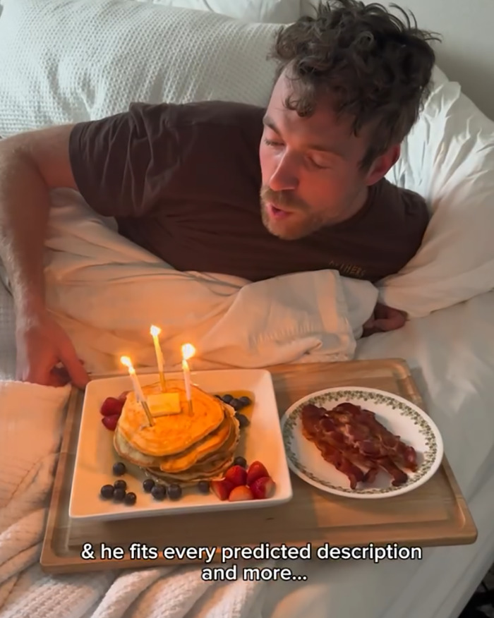 Man in bed blowing out candles on pancakes with bacon breakfast, linked to psychic drawing love life changes viral story Man in bed blowing out candles on pancakes with bacon breakfast, linked to psychic drawing love life changes viral story