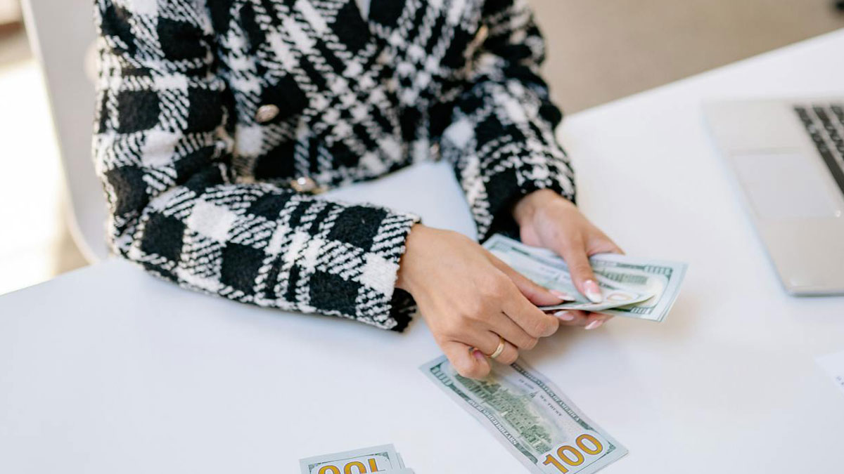 Woman upset counting cash after bride-to-be asks her to pay for her own bridesmaid dress costs