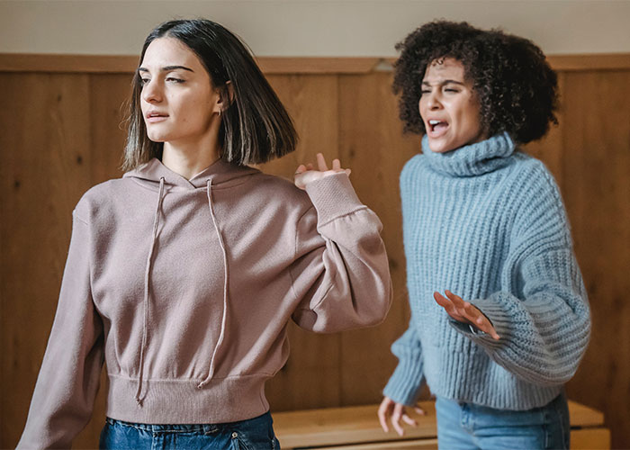 Woman kicks out boyfriend’s female friend wearing inappropriate Halloween costume during tense confrontation indoors Woman kicks out boyfriend’s female friend wearing inappropriate Halloween costume during tense confrontation indoors