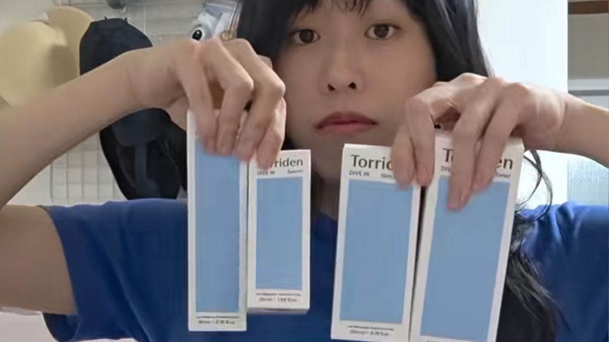 Woman holding multiple gifts received during job interviews in Korea, showcasing appreciation and unique interview perks.