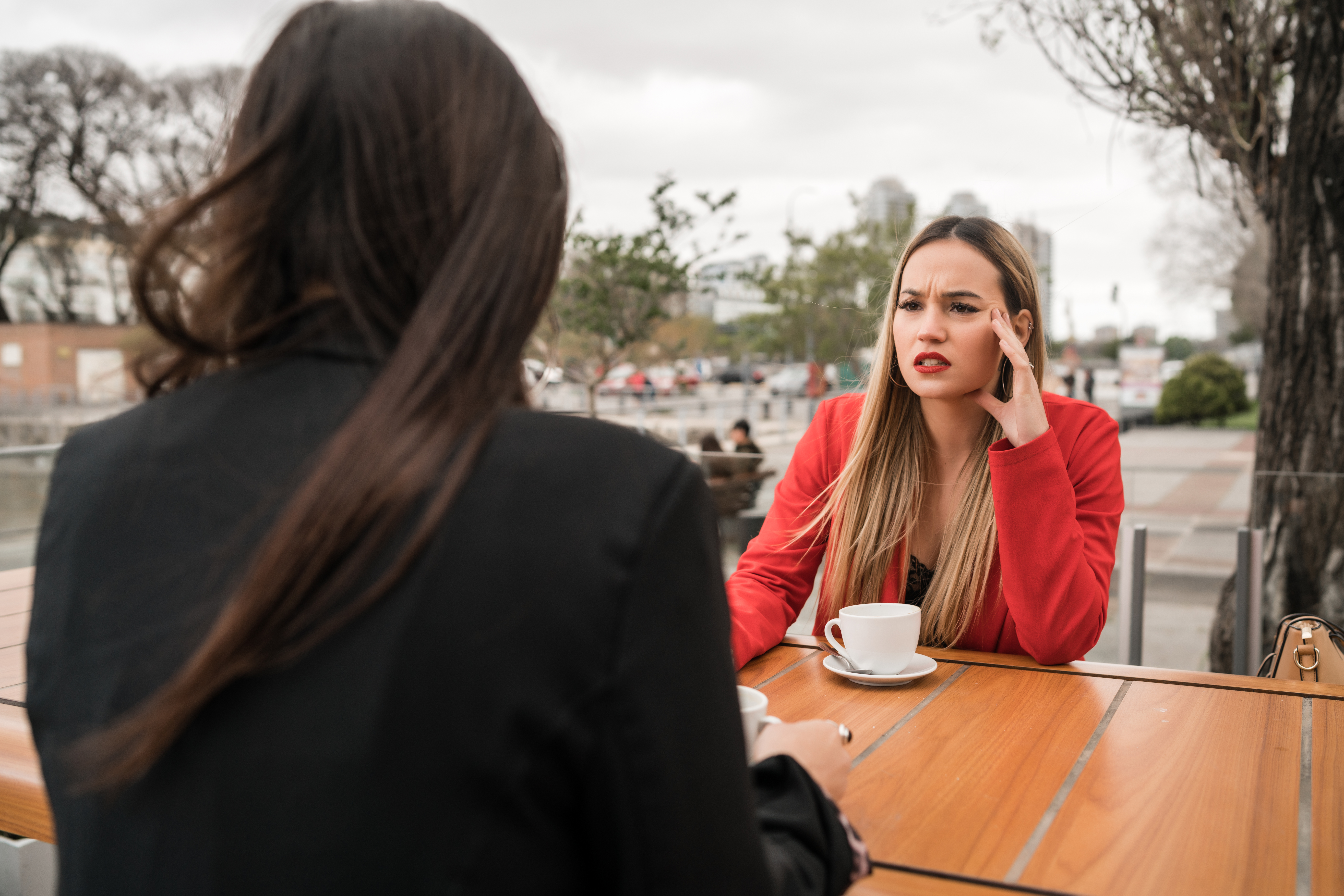 Woman demands combined income as boyfriend is accused of being selfish with money during tense outdoor conversation. Woman demands combined income as boyfriend is accused of being selfish with money during tense outdoor conversation.