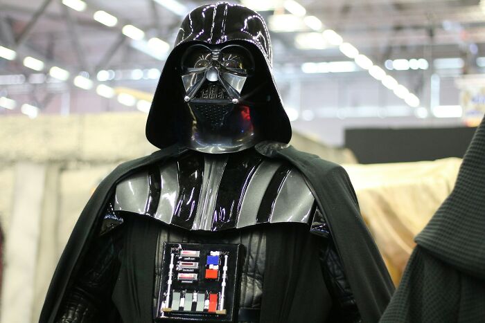 Person dressed as Darth Vader at a convention, illustrating one of the worst Halloween experiences that turned fun into a nightmare.