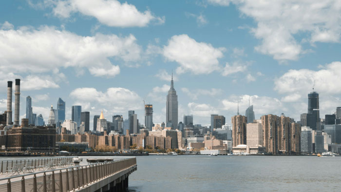 New York City skyline with waterfront, representing the challenge of surviving 27 days in NYC on a $100 budget. New York City skyline with waterfront, representing the challenge of surviving 27 days in NYC on a $100 budget.