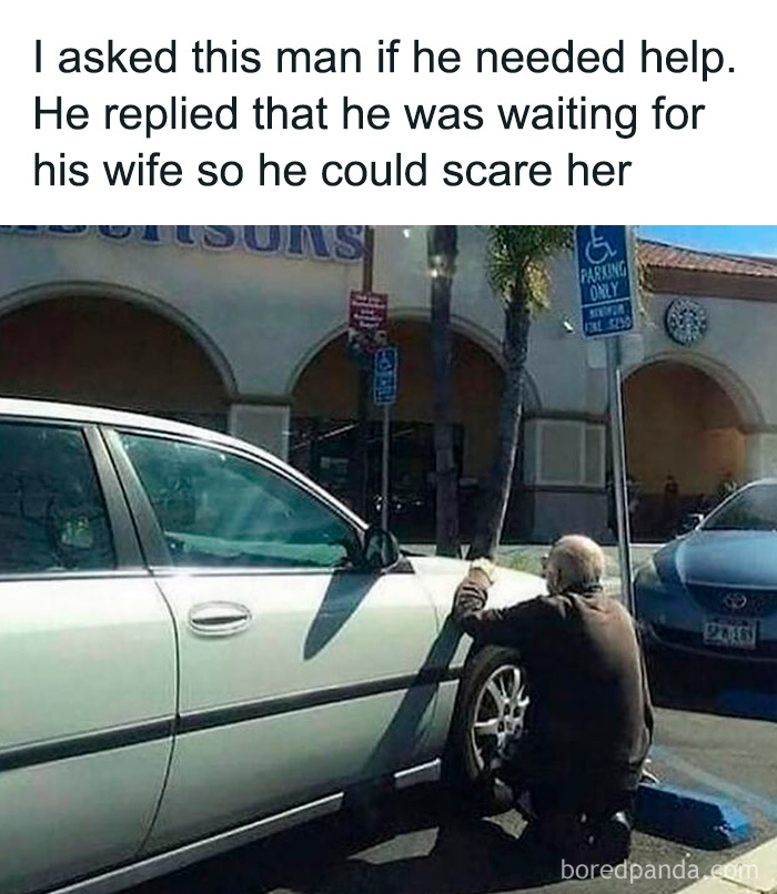 Man kneeling by car tire in parking lot with funny caption, a popular randomly funny meme to lighten life.