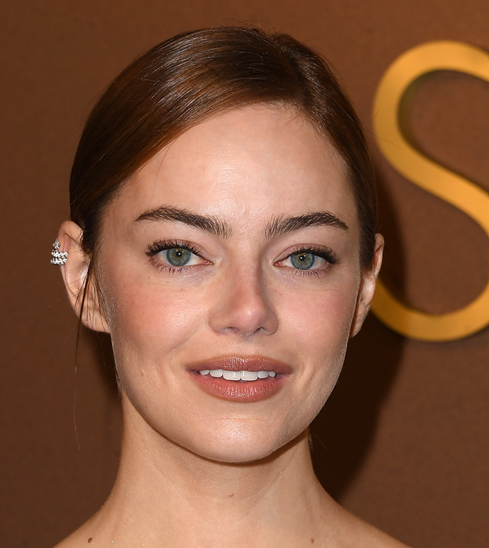 Close-up of a beautiful celebrity with perfect facial features showcasing the golden ratio attractiveness standard. Close-up of a beautiful celebrity with perfect facial features showcasing the golden ratio attractiveness standard.