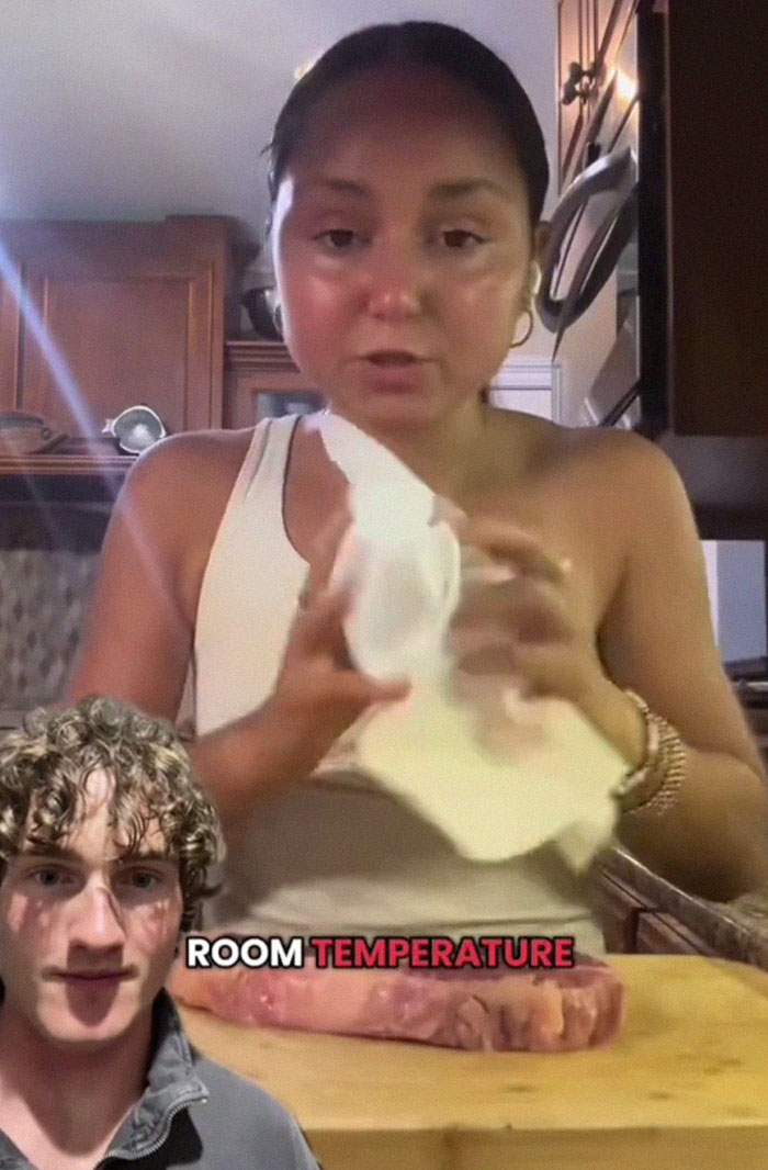 Woman preparing wild American food creations in a kitchen with a man commenting about room temperature steak. Woman preparing wild American food creations in a kitchen with a man commenting about room temperature steak.