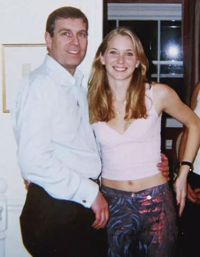 Prince Andrew and a young woman posing together at an indoor social event discussing title removal influenced by female touch.