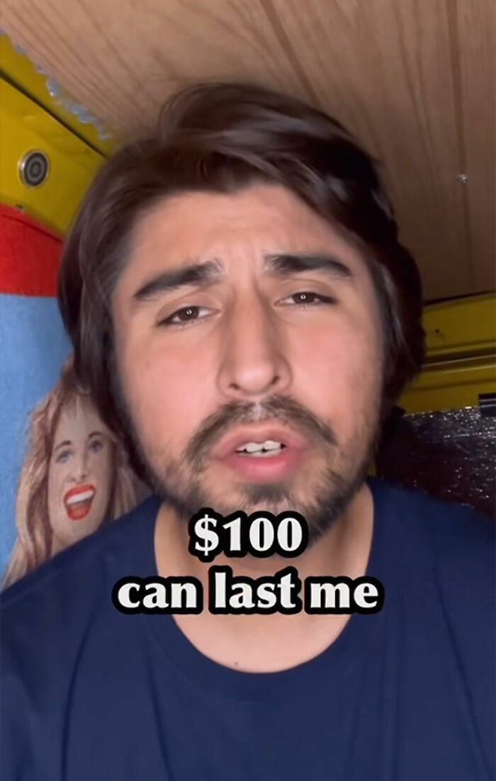 Comedian with beard explaining surviving 27 days in NYC on 100 dollars in a casual indoor setting. Comedian with beard explaining surviving 27 days in NYC on 100 dollars in a casual indoor setting.