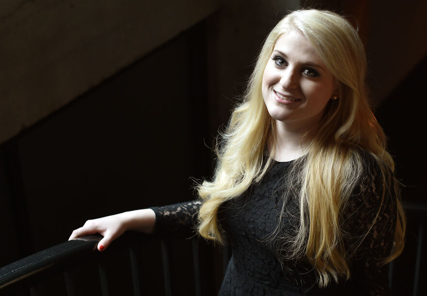 Blonde woman with long hair smiling softly wearing a black lace dress, illustrating Meghan Trainor before and after photos. Blonde woman with long hair smiling softly wearing a black lace dress, illustrating Meghan Trainor before and after photos.