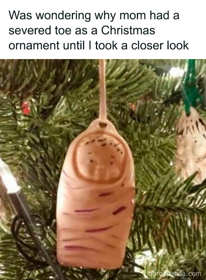 Funny Christmas ornament resembling a severed toe hanging on a tree, part of 75 randomly funny memes collection.
