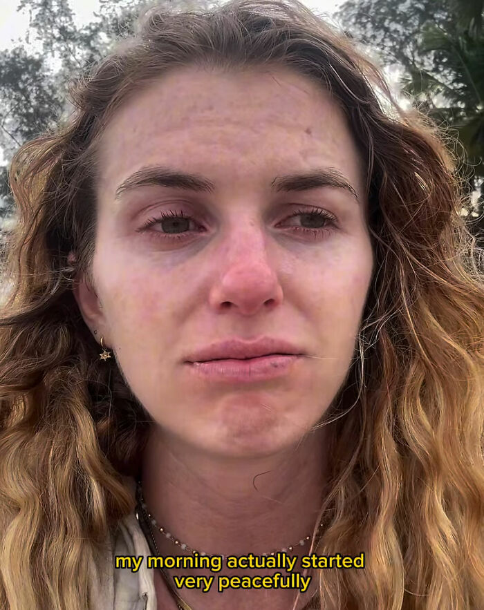 Woman with distressed expression outdoors reflecting on solo traveling experience after recording local man's vile act. Woman with distressed expression outdoors reflecting on solo traveling experience after recording local man's vile act.
