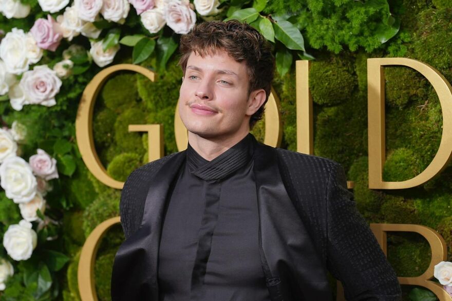 Matt Rife posing at an event, wearing a black suit, highlighting his net worth from big tours and famous purchases. Matt Rife posing at an event, wearing a black suit, highlighting his net worth from big tours and famous purchases.