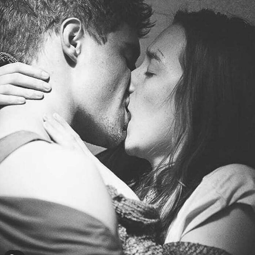 Close-up of a couple sharing a romantic kiss, illustrating different types of kisses and their cultural significance.