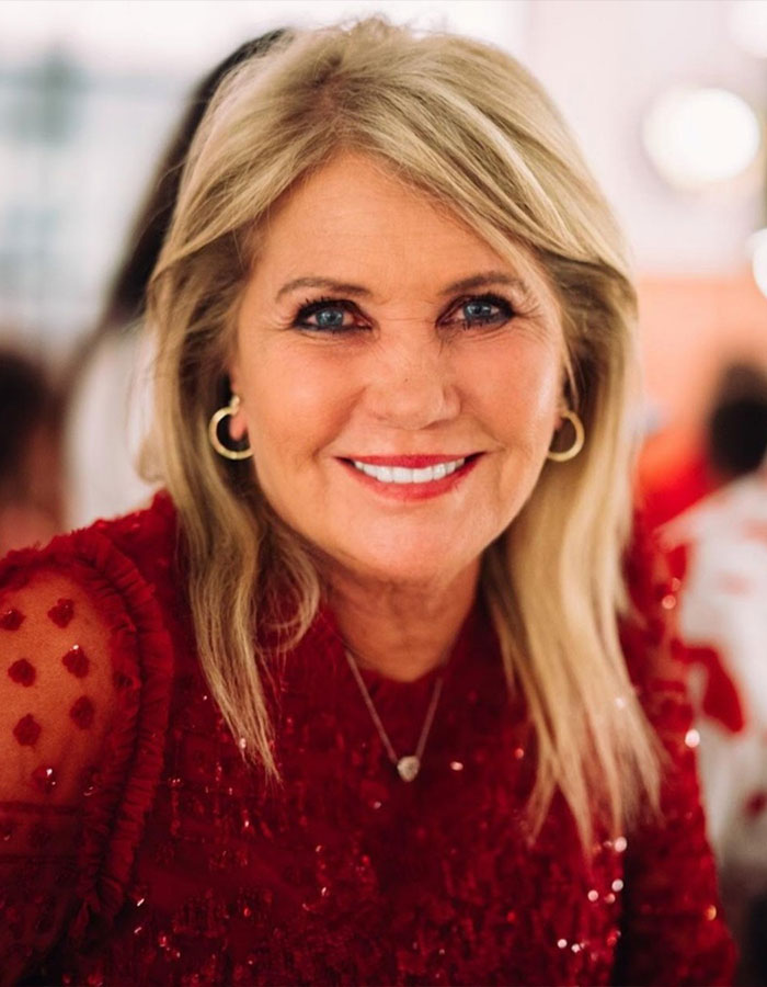 Close-up of a smiling woman in a red dress, related to Richard Branson's heartbreaking statement about his wife Joan. Close-up of a smiling woman in a red dress, related to Richard Branson's heartbreaking statement about his wife Joan.