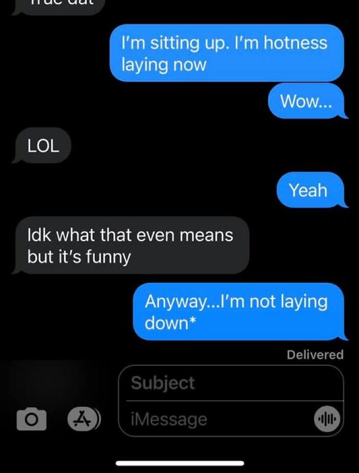 Text message conversation showing a funny autocorrect fail where "hotness laying now" replaces "not laying down."
