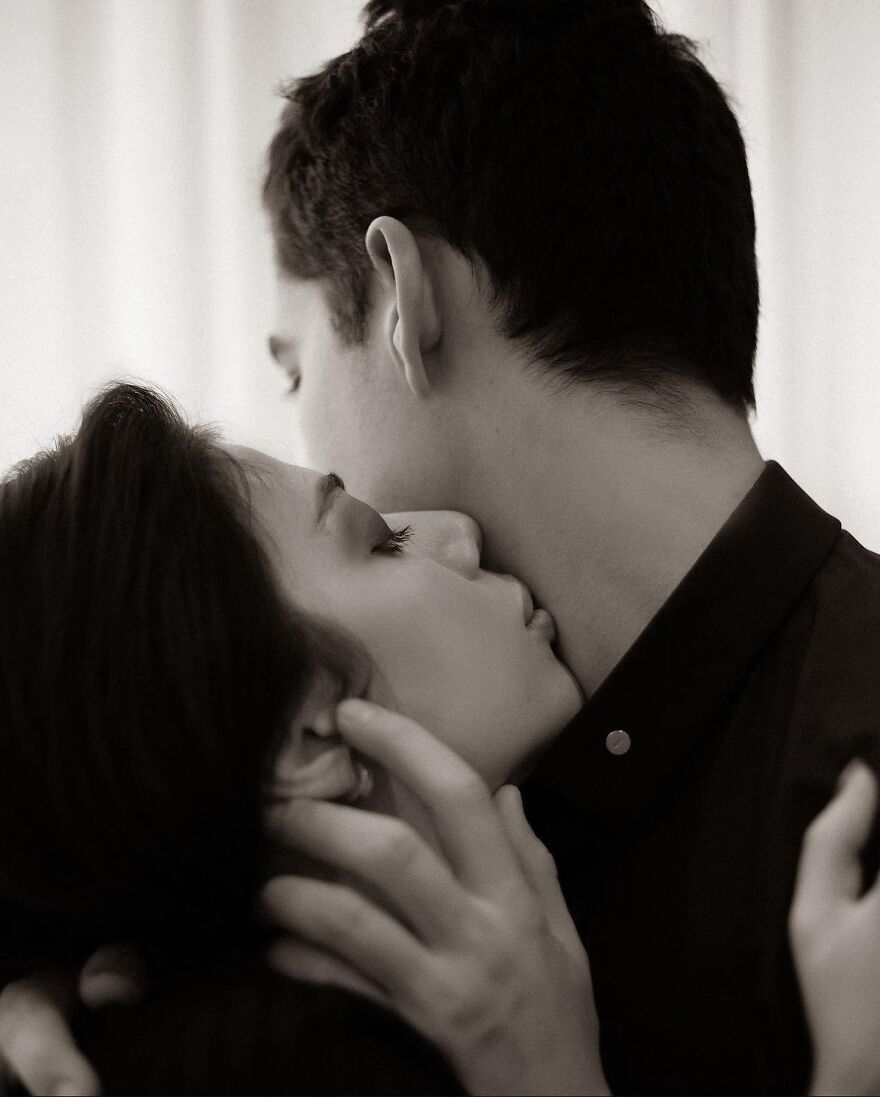 Couple sharing an intimate kiss, illustrating different types of kisses and their cultural and historical significance.