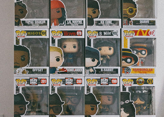 Funko Pop collectibles displayed in boxes representing popular music and movie characters as unusual gift ideas.